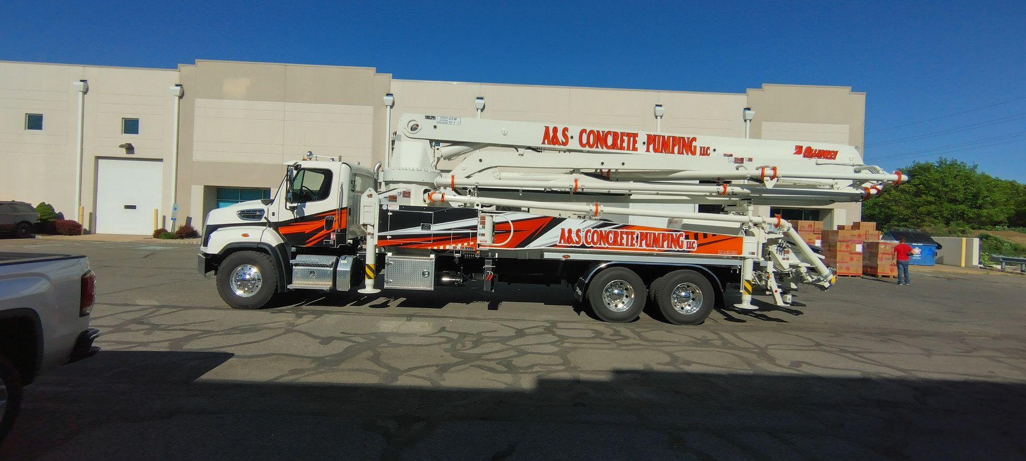 A&S Concrete Pumping boom pump truck, side view, boom folded