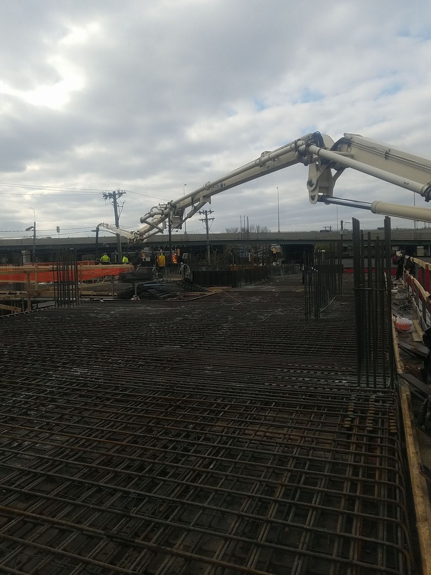 A&S boom pump reaching over a reinforced deck ready for concrete