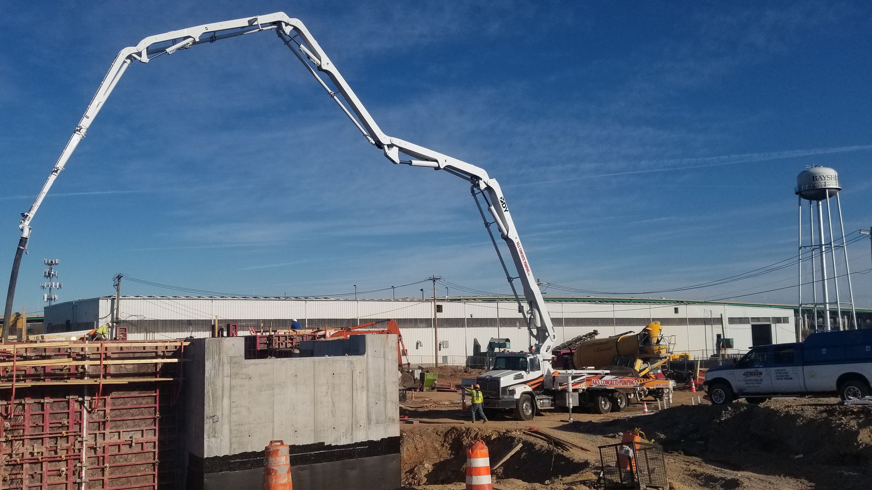 A&S boom pump over tall wall forms at a large site