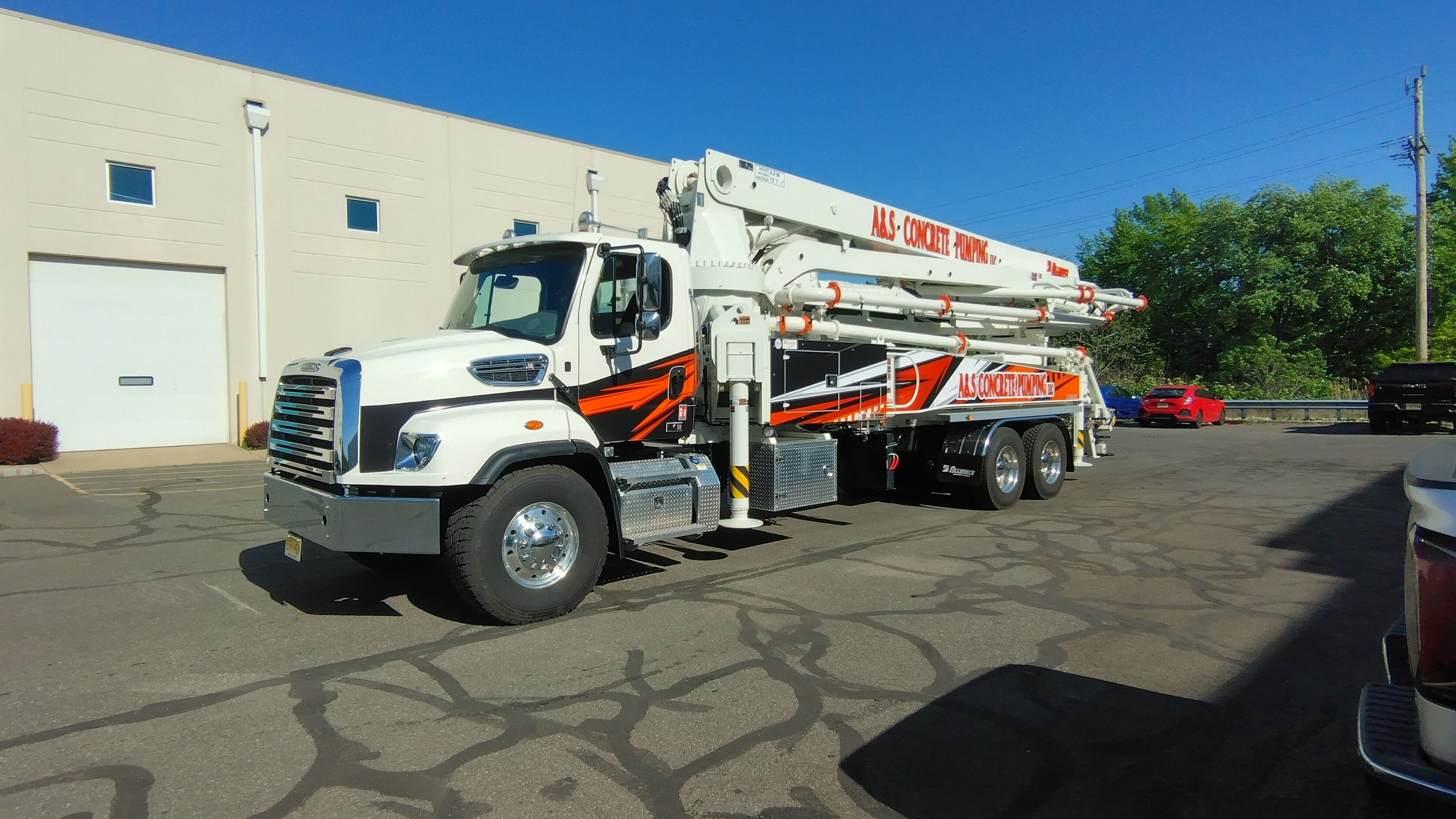 A&S boom pump truck parked with its boom folded